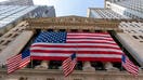 FILE - In this Monday, Sept. 21, 2020, file photo, a giant American Flag hangs on the New York Stock Exchange. U.S. stocks are climbing Monday, Nov. 2, 2020, kicking off a potentially turbulent stretch for markets, as Wall Street recovers some of its sharp sell-off from last week. (AP Photo/Mary Altaffer, File)