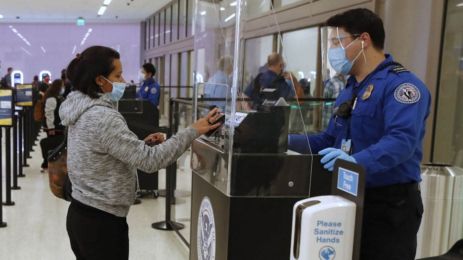 TSA agent checks ID