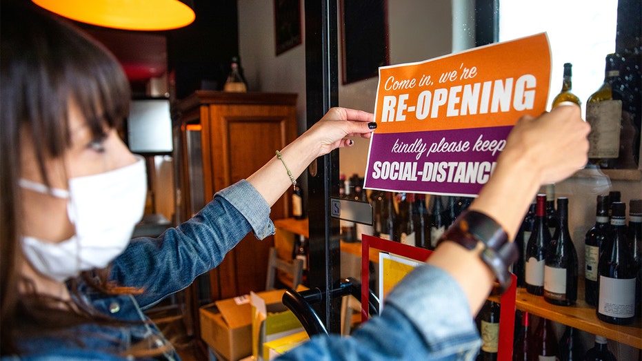 An open sign at a small wine shop during the COVID-19 pandemic. 