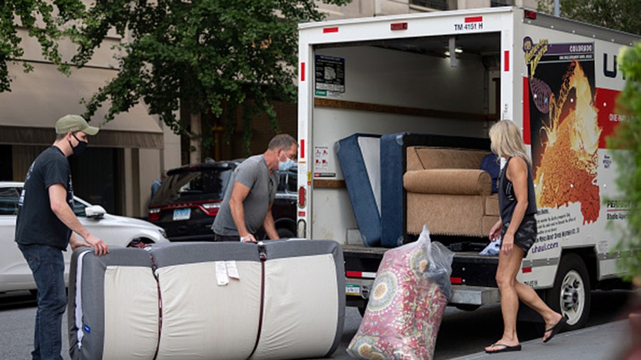 People loading a moving truck