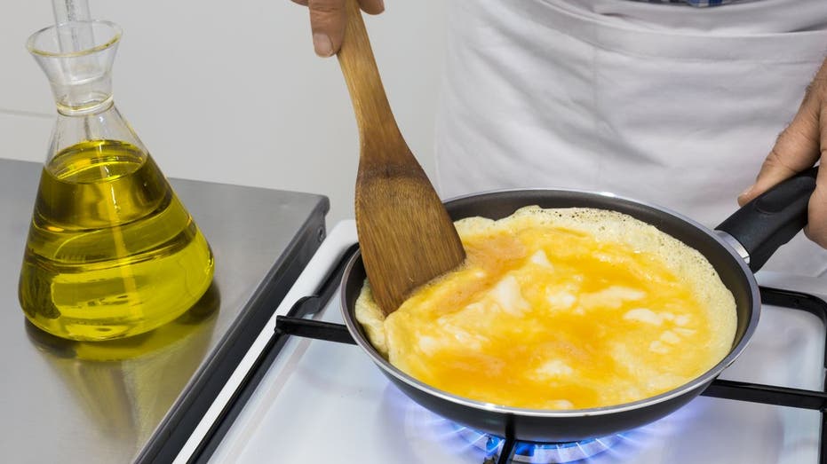 cooking omelet in kitchen