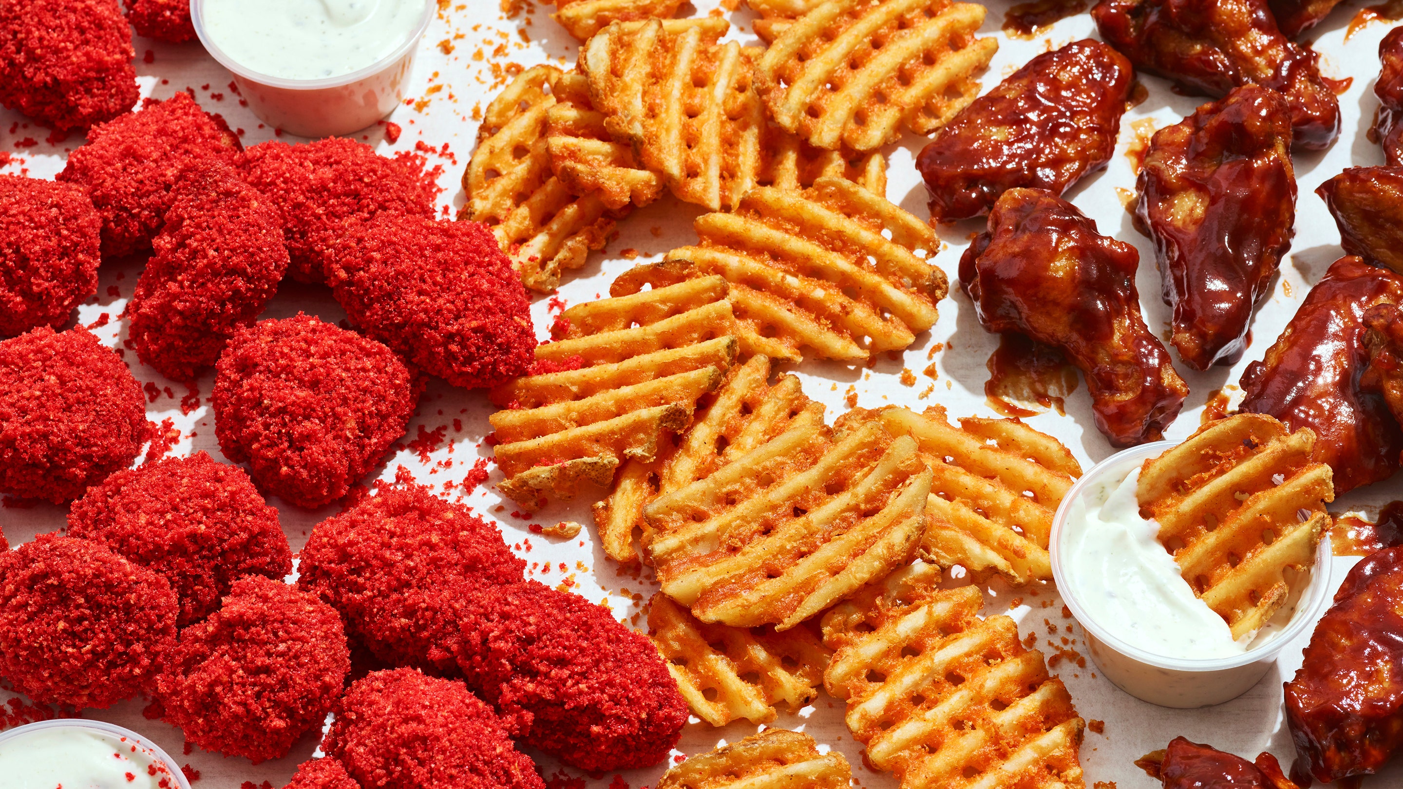 Applebee’s new virtual kitchen sells Cheetos-flavored wings