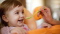 Mother feeding happy toddler girl with a spoon - Fox News