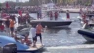 Bucs' Tom Brady on $2M boat, tosses Lombardi Trophy to Rob Gronkowski in Super Bowl parade