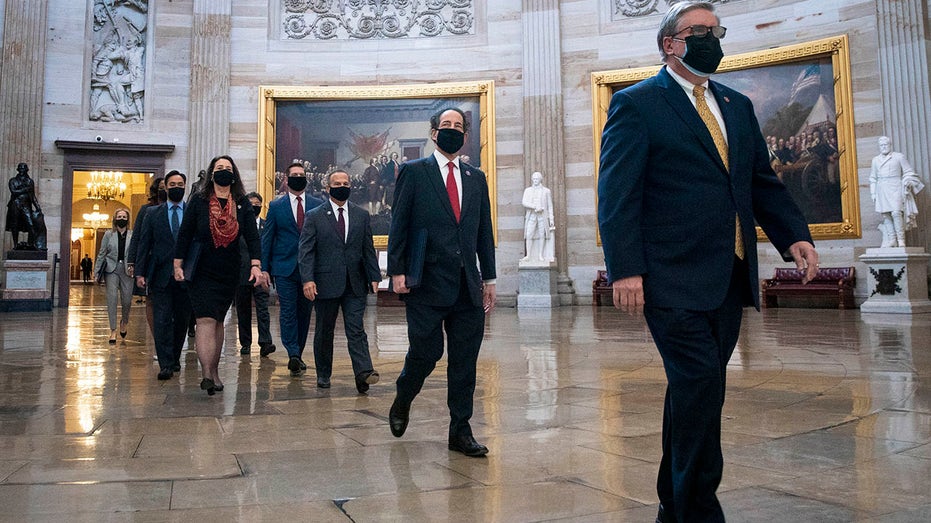 House impeachment managers, lead by Rep. Jamie Raskin, lead manager, proceed through the Capitol Rotunda from the House side of the U.S. Capitol to the U.S. Senate chamber as the second impeachment trial of former President Trump begins Feb. 9, 2021, in Washington, D.C. 