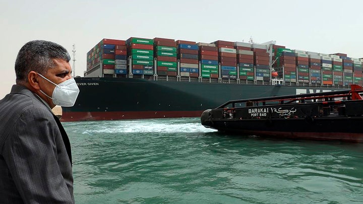 This photo released by the Suez Canal Authority on March 25, 2021, shows Lt. Gen. Ossama Rabei, head of the Suez Canal Authority, investigating the situation with the Ever Given. ((Suez Canal Authority via AP))
