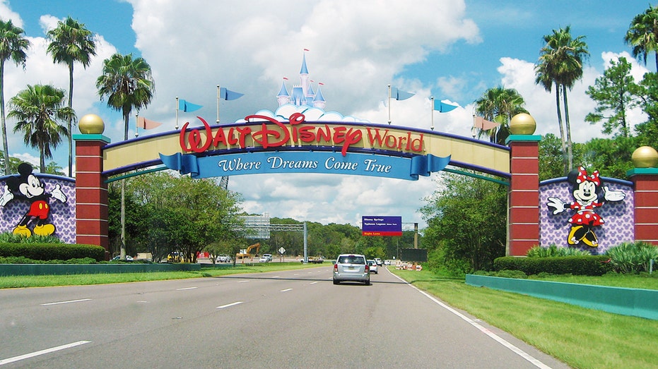 Photo shows car driving done entranceway of Walt Disney World successful Orlando