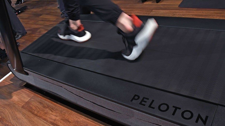 A person running on a Peloton treadmill