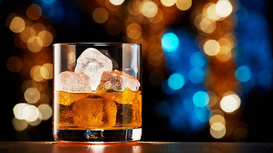 Glass of whiskey with ice