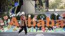 People walk past the Alibaba headquarters.