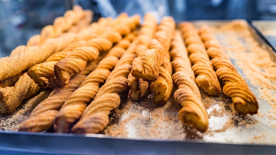 Churros on display at a store.