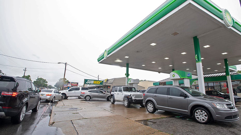 cars lined up at a BP gas station