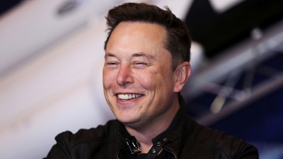 Elon Musk, founder of SpaceX and chief executive officer of Tesla Inc., arrives at the Axel Springer Award ceremony in Berlin, Germany, on Tuesday, Dec. 1, 2020. Tesla Inc. will be added to the S&P 500 Index in one shot on Dec. 21, a move that will ripple through the entire market as money managers adjust their portfolios to make room for shares of the $538 billion company. Photographer: Liesa Johannssen-Koppitz/Bloomberg via Getty Images