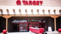 Santa Fe, NM:  A Target employee pulls red shopping carts into the Santa Fe NM store. Santa Fe’s Target is constructed in the Southwest Pueblo architectural style. - Fox News