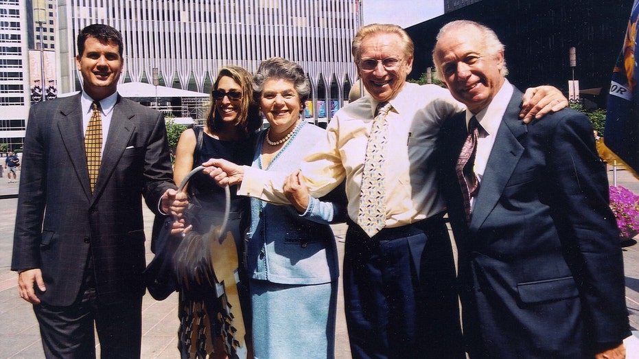 Larry Silverstein and his family pose for a photo after receiving the keys to 7 World Trade Center in 2001