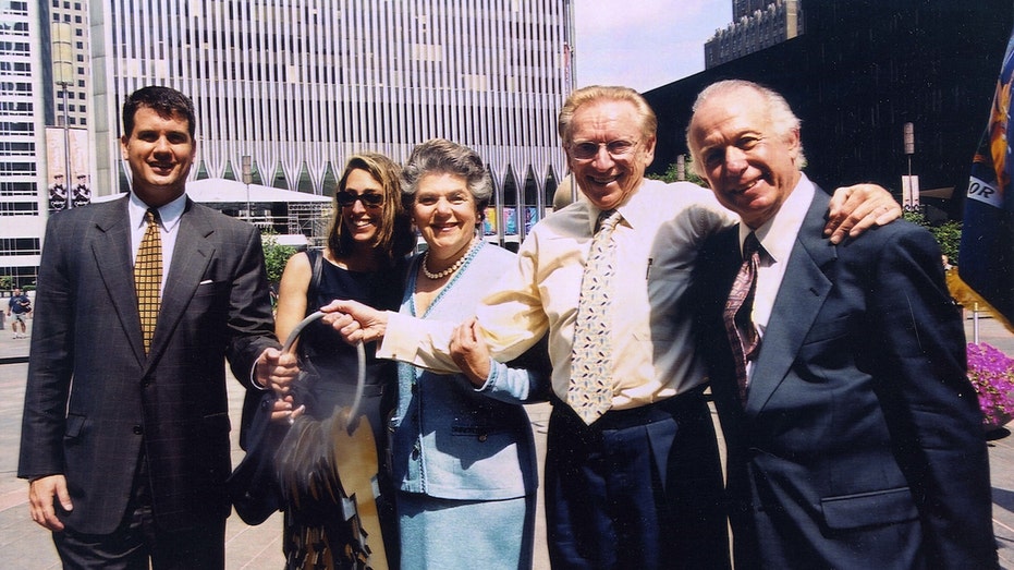 Larry Silverstein and his family pose for a photo after receiving the keys to 7 World Trade Center in 2001