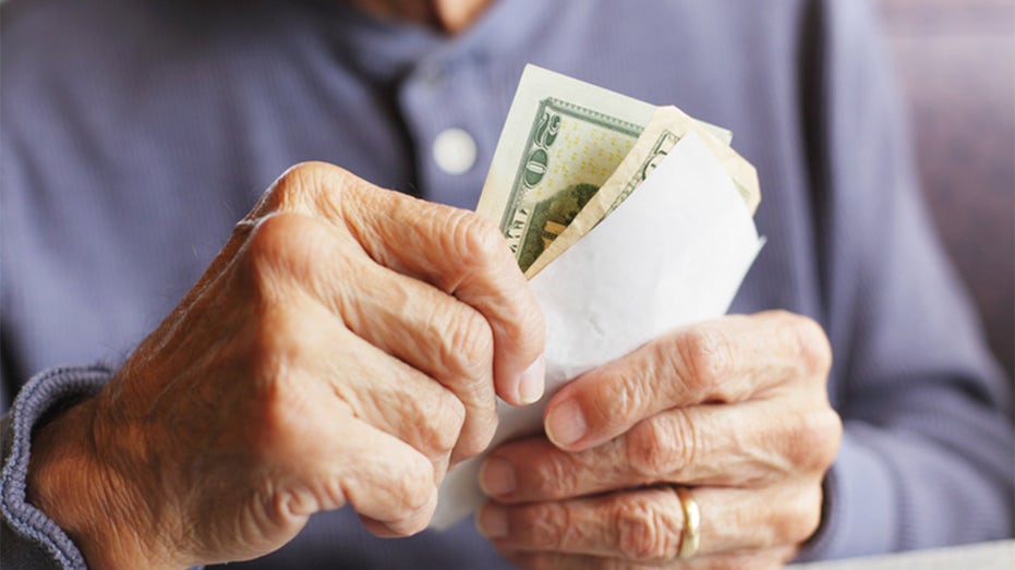 Person holding money