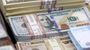 Dollar hits four-month high on euro as markets bet on earlier Fed taper