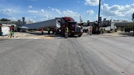 Freight train in Texas smashes through semi-truck hauling wind turbine blade, video shows