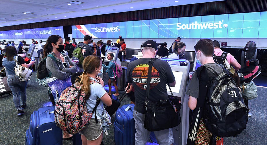 Travelers check in for a Southwest Airlines flight