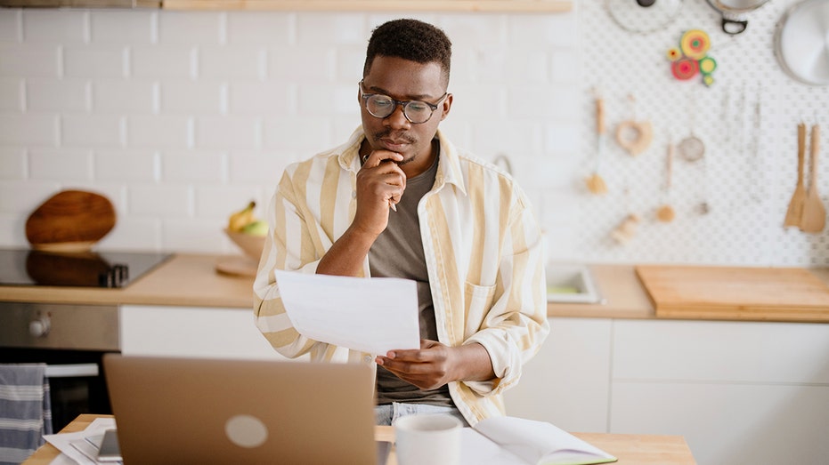 Man looking at a document 