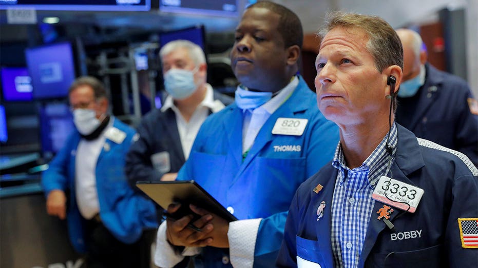 Traders work on the floor at the New York Stock Exchange in Manhattan, New York City, Aug. 20, 2021.