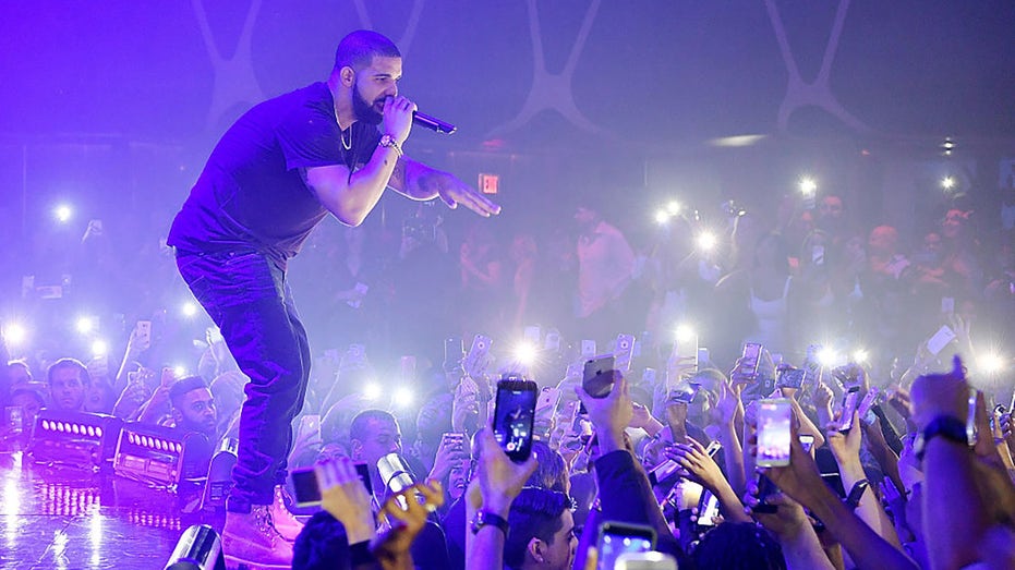 Drake performing at a concert