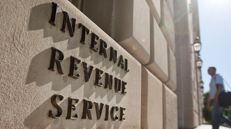 A man enters the Internal Revenue Service (IRS) building in Washington, D.C., on Friday, May 7, 2010.