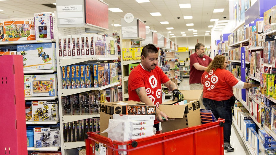 Employees restock toys at a Target Corp. store on Black Friday in Dallas, Texas, on Friday, Nov. 24, 2017. 