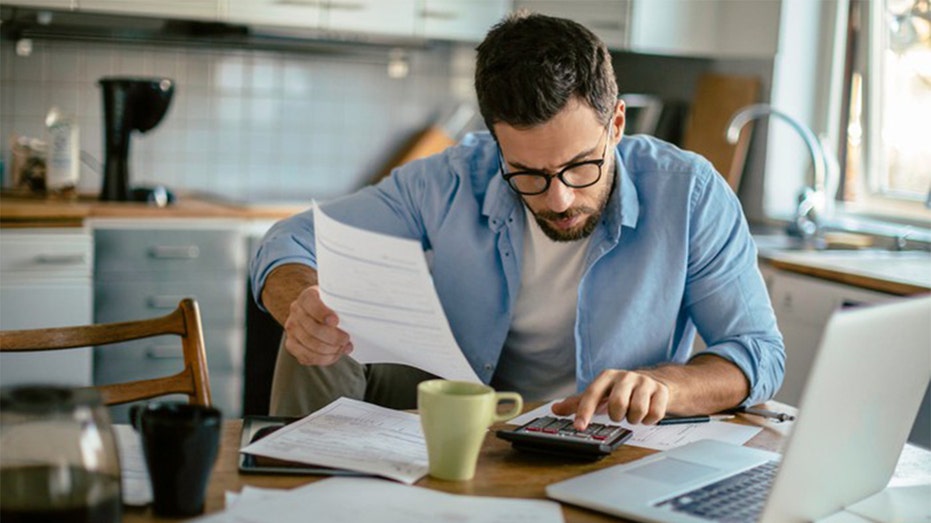 A man reviewing his taxes