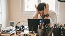 Tired frustrated exhausted businessman working from home online sitting at home office with laptop during quarantine and self isolation period at pandemic. Crisis management. Despair of market falling down. - Fox Business News