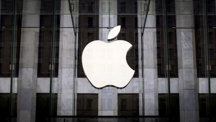 An Apple logo hangs above the entrance to the Apple store on 5th Avenue in the Manhattan borough of New York City, July 21, 2015. REUTERS/Mike Segar/File Photo