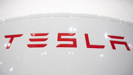 19 August 2021, Berlin: A Tesla charging station in a Tesla showroom features the manufacturer's logo. Photo: Christophe Gateau/dpa (Photo by Christophe Gateau/picture alliance via Getty Images)