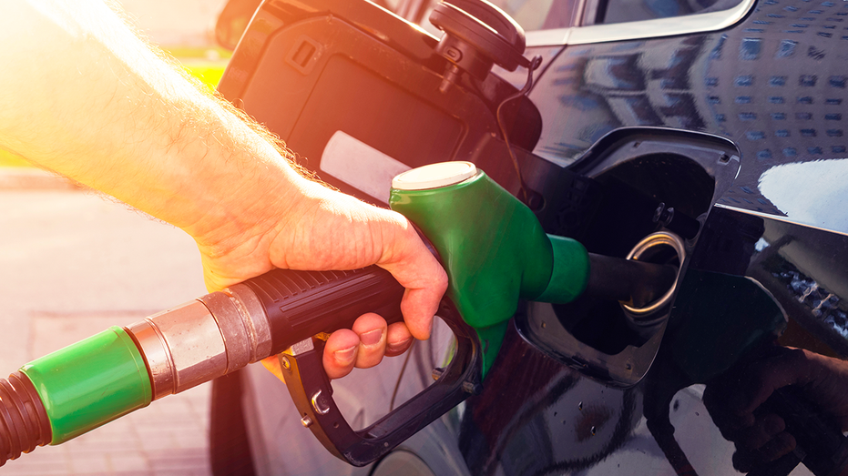 Man pumping gas into his car