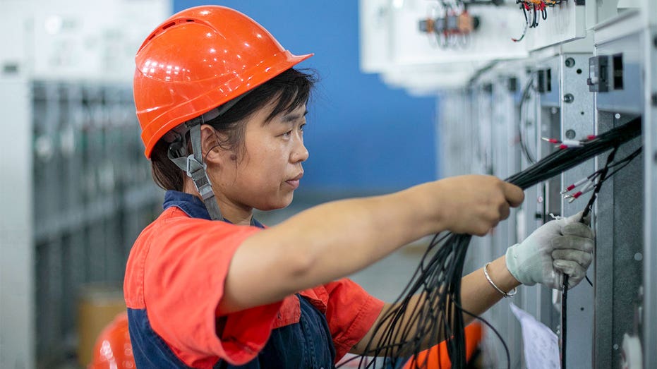 WORKER-ELECTRICAL-WORK-CHINA-POWER-SHORTAGE