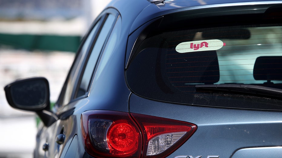 The Lyft logo is displayed on a car on March 11, 2019, in San Francisco, California. 