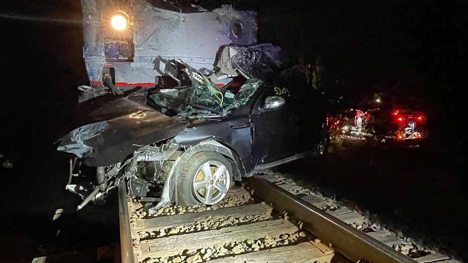 An Amtrak train collided with a semi-truck hauling multiple cars in Oklahoma on Friday, sending vehicles hurling into the air and injuring four passengers onboard the train, authorities said.