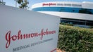 An entry sign to the Johnson &amp; Johnson campus shows their logo in Irvine, California on August 28, 2019. - The US pharmaceutical industry faces tens of billions of dollars in potential damage payments for fueling the opioid addiction crisis after Oklahoma won a $572 million judgment against drugmaker Johnson &amp;amp; Johnson. (Photo by Mark RALSTON / AFP) (Photo by MARK RALSTON/AFP via Getty Images)