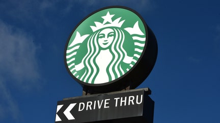 STOKE ON TRENT, ENGLAND - NOVEMBER 04: The American Coffeehouse company, Starbucks logo is displayed outside one of its stores on November 04, 2021 in Stoke on Trent, England. (Photo by Nathan Stirk/Getty Images)