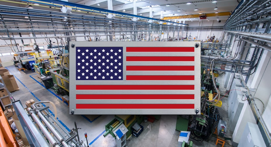 Manufacturing plant behind American flag