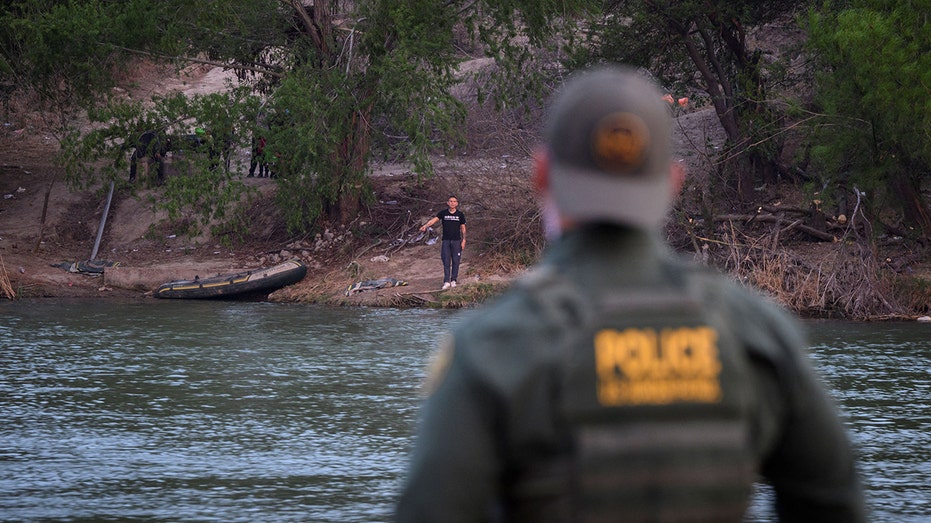 Border agent by river