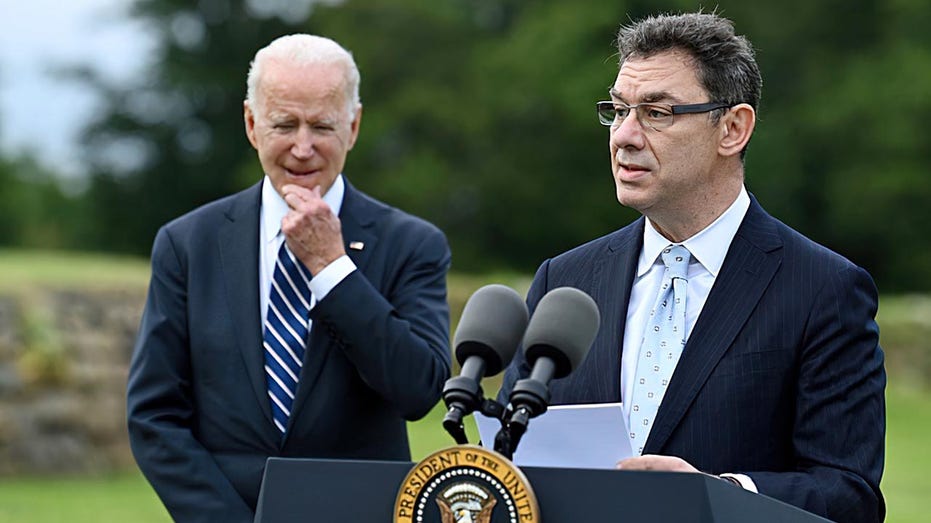 President Biden (L) listens as Pfizer CEO Albert Bourla make a statements in St Ives, Cornwall, England, on June 10, 2021, ahead of the three-day G7 summit.