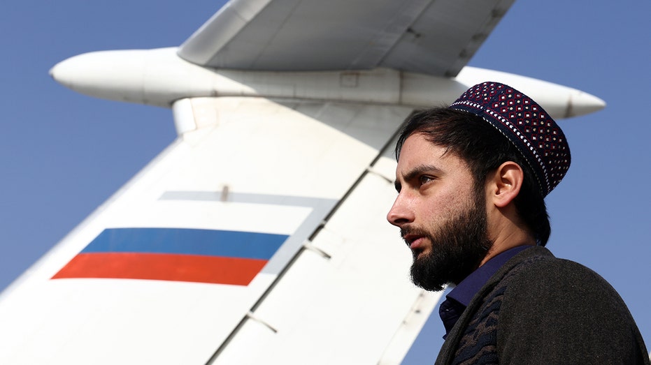 A member of the Taliban movement (banned in Russia), seen near an Ilyushin Il-76 airlifter of the Russian Aerospace Forces that has delivered humanitarian aid, at Kabul airport. 