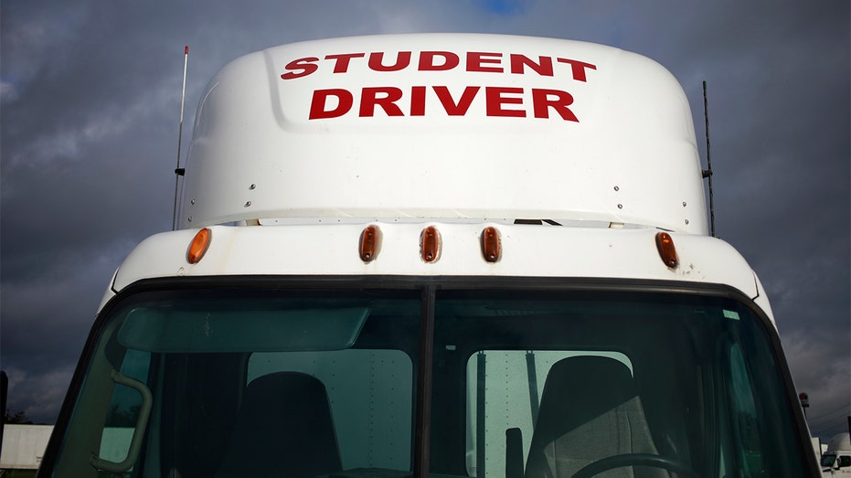 A semi truck used by students while earning their commercial driver's license (CDL) parked at Truck America Training of Kentucky in Shepherdsville, Kentucky, Monday, Oct. 25, 2021.