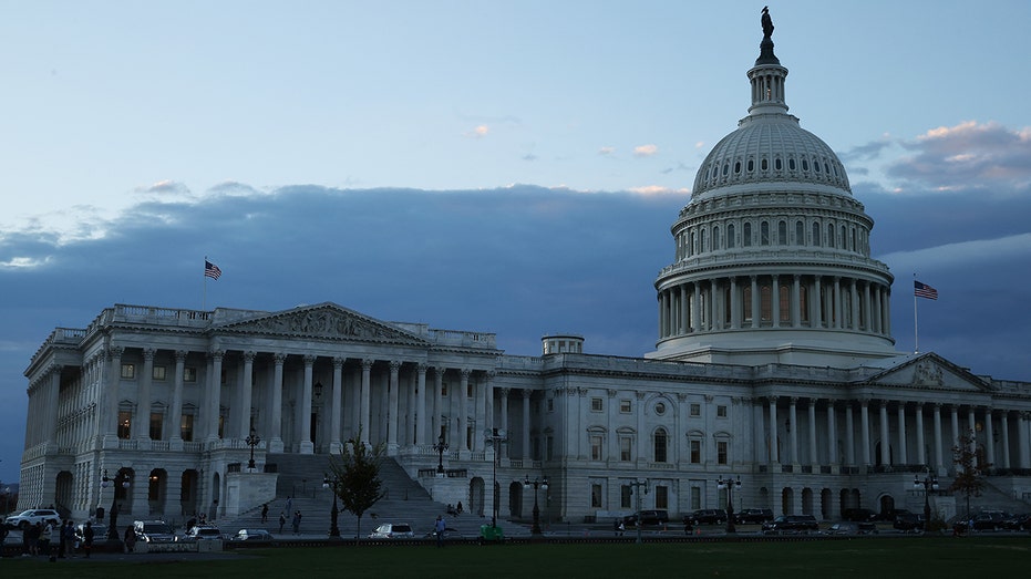 The sun sets behind the U.S. Capitol on Nov. 18, 2021, in Washington, D.C.