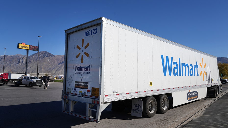 A Walmart truck pulls away after fueling up along with other truckers at the Loves Truck stop on Nov. 5, 2021, in Springville, Utah.