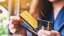A woman holding credit cards. - Fox Business News