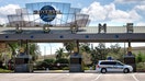 A security guard is posted at the parking turnstile to Universal Orlando, Tuesday, March 17, 2020, in Orlando, Fla.  - Fox Business News