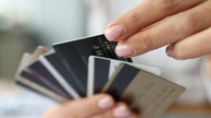 Credit card debt soars to new record as high inflation squeezes Americans
