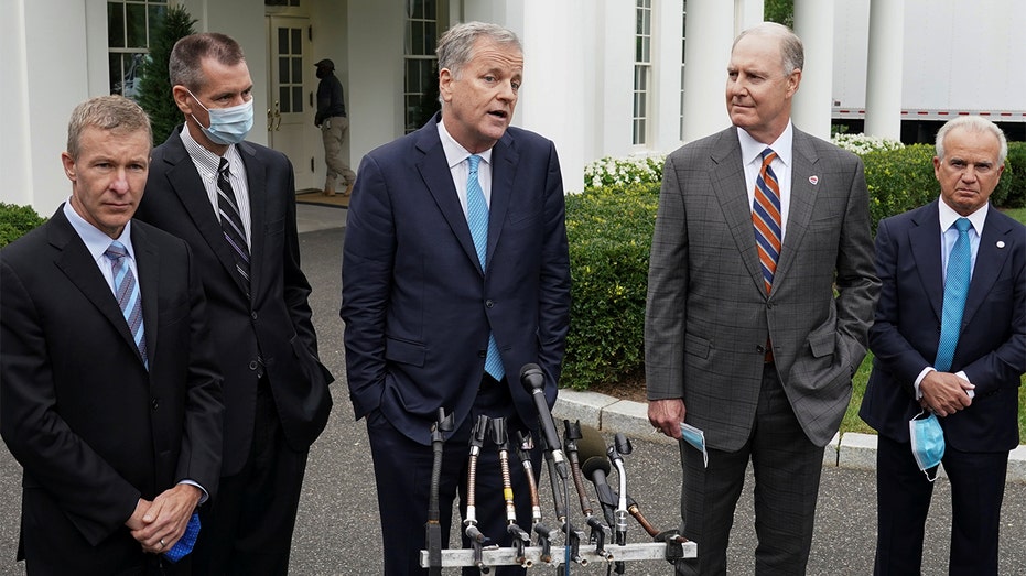 Flanked by other airline executives, American Airlines CEO Doug Parker speaks to reporters after meeting with White House Chief of Staff Mark Meadows in Washington, Sept. 17, 2020. 